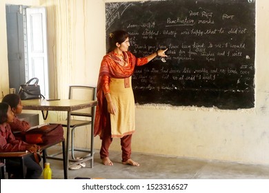 Fatehabad, Haryana, India - 1 October, 2019: Unidentified Female Indian Teacher Teaching In Classroom