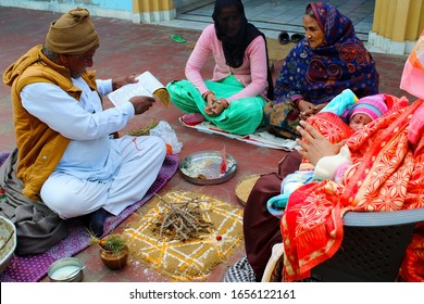 Fatehabad, Haryana, India - February 2, 2020: Homa or havan fire ceremony performed at home. Homa havan ritual according to vedic tradition.performing homa, hindu prayer. 