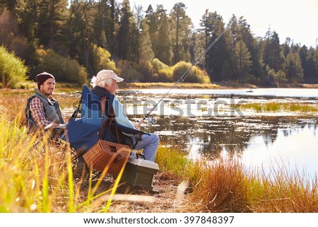 Father and adult son fishing lakeside, Big Bear, California
