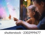 Father, aquarium and girl pointing at fish for learning, curiosity and knowledge, education and bonding. Dad, oceanarium and child with parent watching marine life underwater in fishtank on vacation.