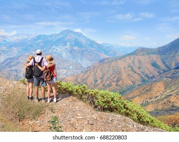 Father With Arms Around His Family  Looking At Beautiful Summer Mountains Landscape, On Hiking Trip .Kings Canyon National Park, Southern Sierra Nevada, East Of Fresno, California. ,USA.