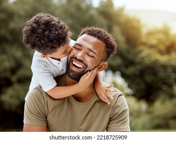 Father, bonding kiss and boy child hug happy in nature with quality time together outdoor. Happiness, laughing and family love of a dad and kid in a park enjoying nature hugging with care and a smile - Shutterstock ID 2218725909