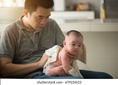 Father Burping Baby Boy After Meal