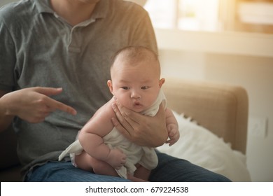 Father Burping Baby Boy After Meal