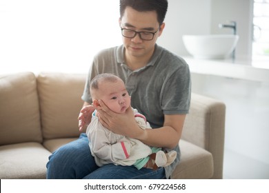 Father Burping Baby Boy After Meal