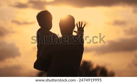 Similar – Foto Bild Junger Mann mit Kleinkind und Kindersitz verlässt eine Hütte in einer Dünenlandschaft in Dänemark