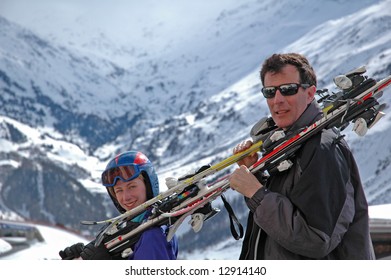 Father And Child Going Skiing