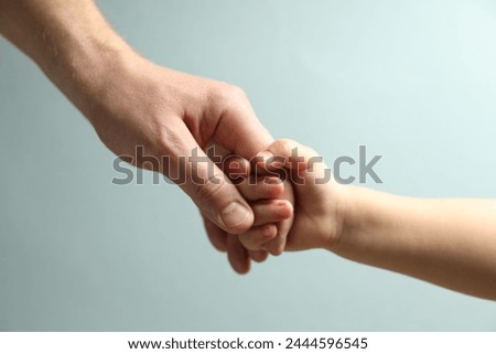 Similar – Image, Stock Photo Child holds hand in front of the camera