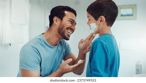 Father, child and learning with shaving cream or teaching a boy a skincare, morning beauty routine and grooming in the bathroom. Shave together, son and dad helping with foam, razor and skin care - Powered by Shutterstock