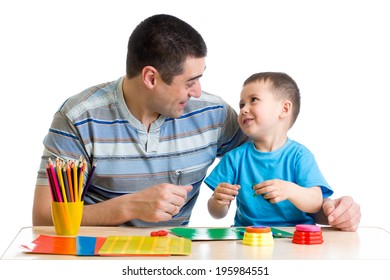 Father And Child Play With Clay Together