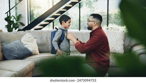 Father, child and son with backpack in living room for preparation, getting ready or back to school. Family, support and happy kid with dad for morning routine, education development or love in home - Powered by Shutterstock