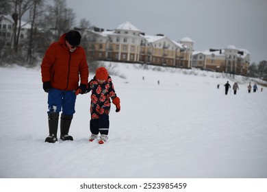 Father and Child Walking on Snowy Path in Winter Urban Park - Powered by Shutterstock