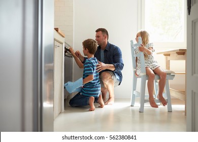 Father And Children Baking Homemade Pizza In Oven - Powered by Shutterstock