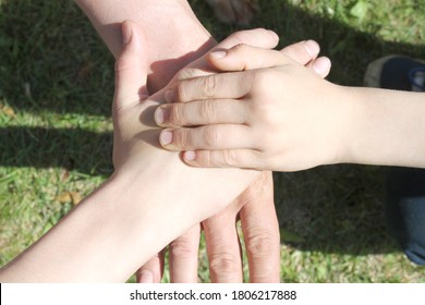 Father And Children Crossed Their Hands. Generational Connection, Family, Mutual Understanding, Friendship.