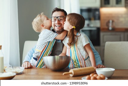 Father With Children Preparing Food, Baking Cookies
