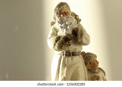 Father Christmas And Child Looking Up At The Winter Sky, Old World Christmas Ornament For The Holiday's. 