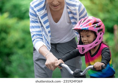 Father or coach supervises the little rider while training, with parent supervision - Powered by Shutterstock