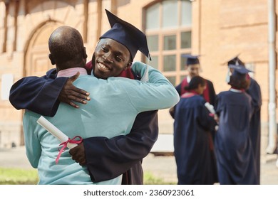 Father congratulating his son with graduation - Powered by Shutterstock