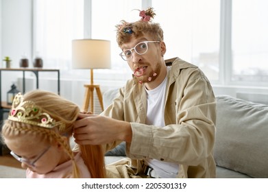 Father With Crazy Hairstyle Making Hair For Daughter