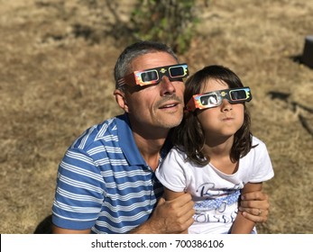 Father And Daugher Watching Solar Eclipse