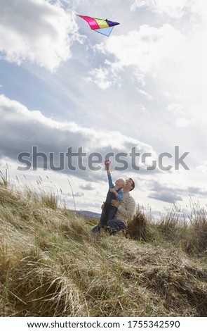 Similar – Image, Stock Photo Young couple taking a walk near the coast