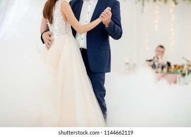 Father And Daughter Dance At The Wedding. Dancing In The Fog. Groom At The Background, Watching Them