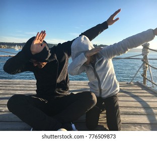 Father And Daughter Doing Dab On The Pier