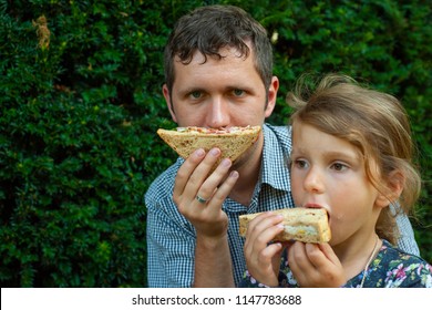 Father And Daughter Are Eating BLT Sandwich 