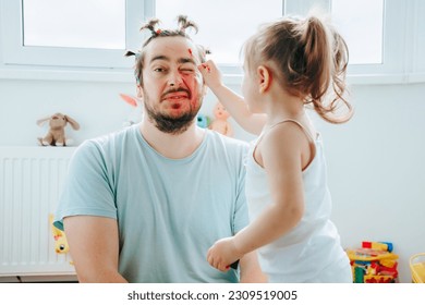 A father and daughter enjoying a funny and creative makeup session at home, with the dad encouraging his child's imagination. Laughter and Lipstick A Funny Father Daughter Moment Captured Forever