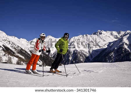 father and daughter enjoying winter sports