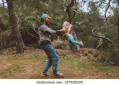 Father and daughter family walking in forest playing together healthy lifestyle summer vacations parents and kid having fun outdoor happiness emotions