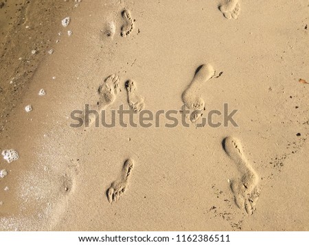 Father and daughter foot prints