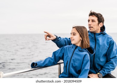 Father and daughter having fun on sailing boat at the beach during vacation - Love and family concept - Main focus on girl face - Powered by Shutterstock