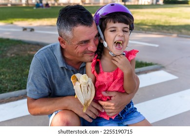 father and daughter having fun outdoors - Shutterstock ID 2255190715