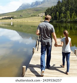 Father, daughter and holding hands by lake for fishing, vacation or summer with walk on jetty. Dad, man and girl child with bonding, connection and outdoor for adventure, learning or holiday by river - Powered by Shutterstock