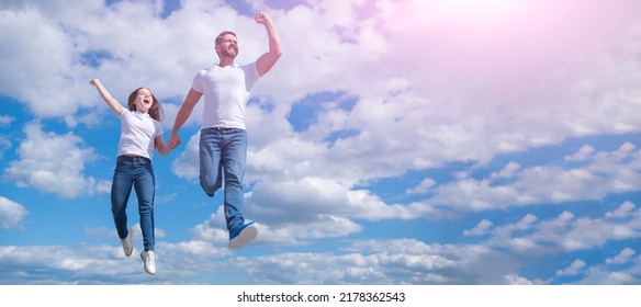 Father And Daughter Jumping In Sky, Banner With Copy Space. Bright Future.