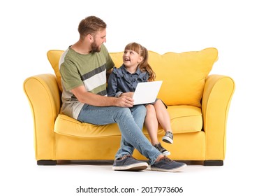 Father And Daughter With Laptop On Sofa Against White Background