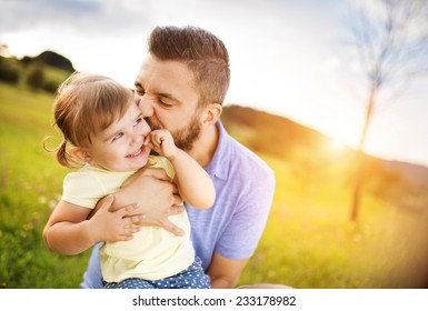 Father And Daughter In Nature