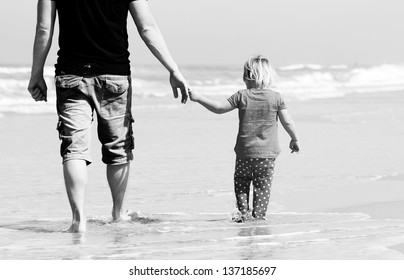 Father And Daughter On The Beach