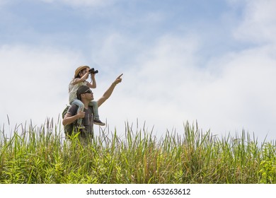 Father and daughter playing with a shoulder car - Powered by Shutterstock