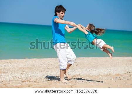 Similar – Image, Stock Photo Father and son playing superhero on the beach at the day time. People having fun outdoors. Concept of summer vacation and friendly family.