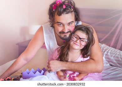 Father And Daughter Are Playing Together. Dress Up As Princesses And Paint Their Faces