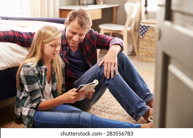 Father and daughter reading together