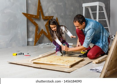 father and daughter are repairing in the garage - Powered by Shutterstock