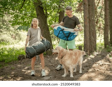 Father And Daughter Setting Up A Tent With Golden Retriever Dog, Enjoying Eco-Tourism - Powered by Shutterstock