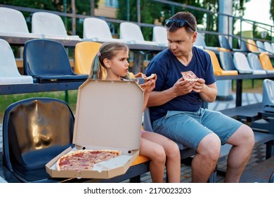 Father With Daughter, Soccer Fans, Watching Football Match, Eating Pizza And Cheering For Local Team At Stadium, Real Emotions, Sports Event And Fan Supporting, Outdoor Lifestyle, Street Food