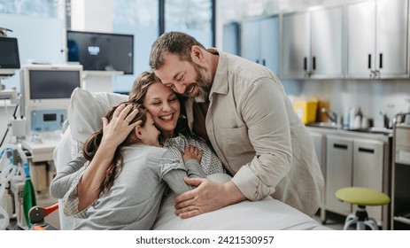 Father and daughter visiting mother in hospital after surgery. Emotional support from family for patients in hospital. - Powered by Shutterstock