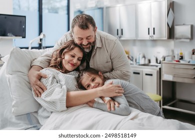 Father and daughter visiting mother in hospital after surgery. Emotional support from family for patients in hospital. - Powered by Shutterstock