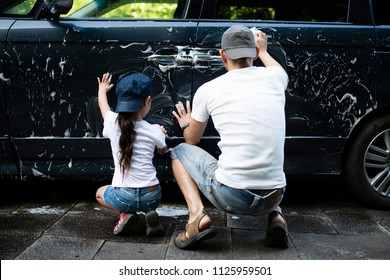 Father and daughter wash the car - Powered by Shutterstock
