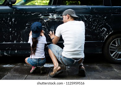 Father and daughter wash the car - Powered by Shutterstock